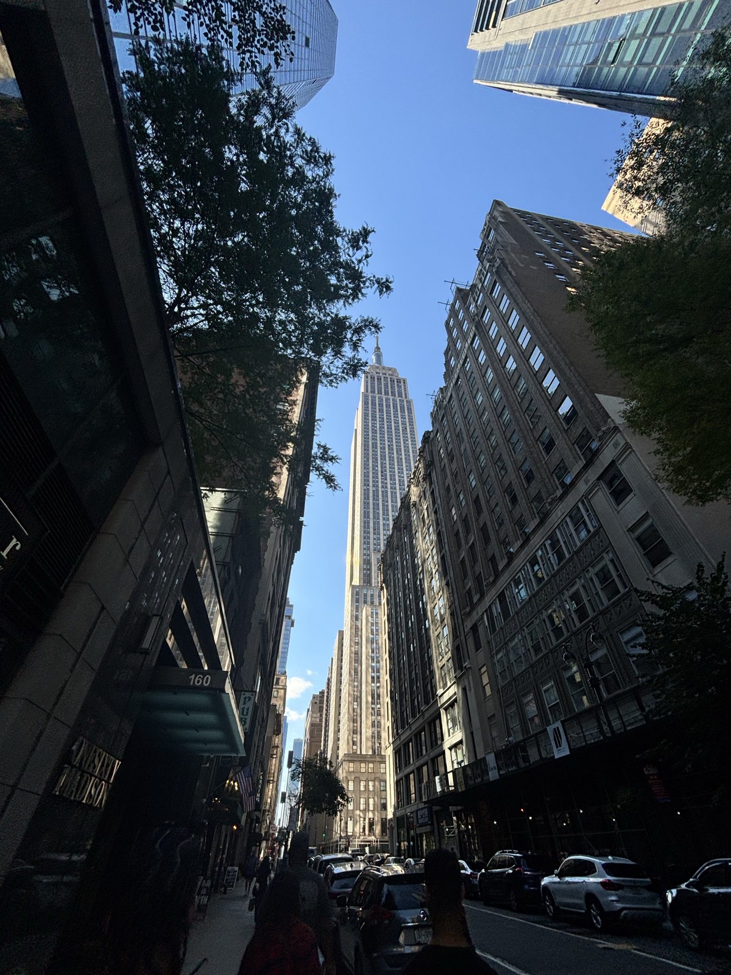 Looking up a Midtown street toward the Empire State Building